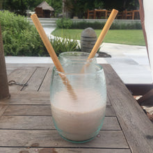 Load image into Gallery viewer, two bamboo straws in a smoothie drink